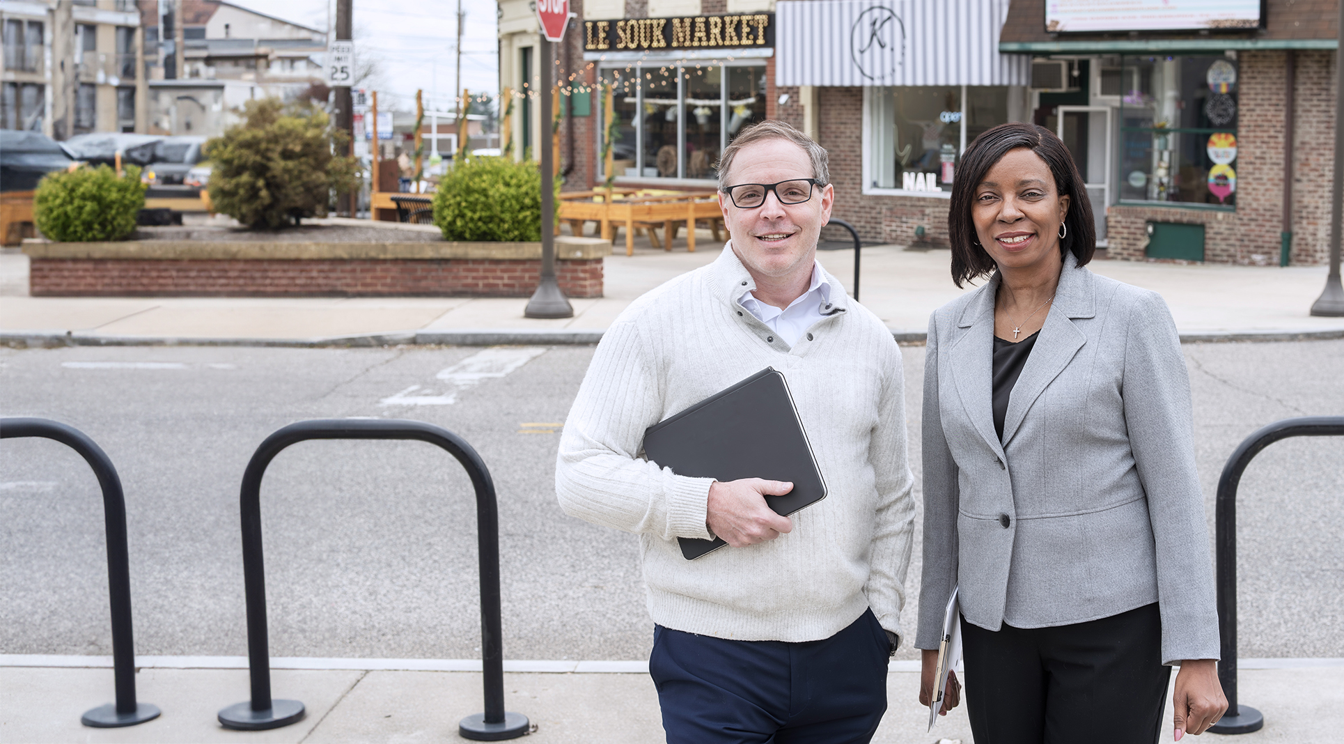 Drs. Charnita Zeigler-Johnson and Kevin Henry standing on a street